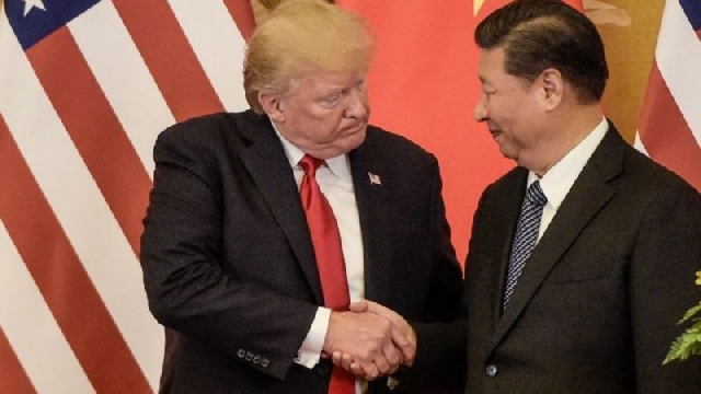 Donald Trump, pictured here with President Xi Jinping