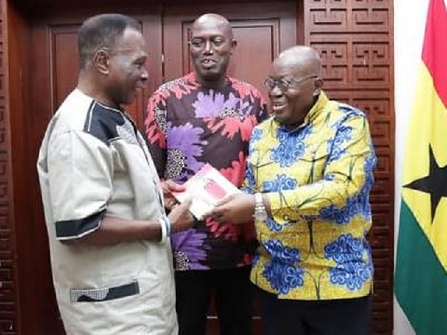D. K Poison(L) in a photo with President Akufo-Addo